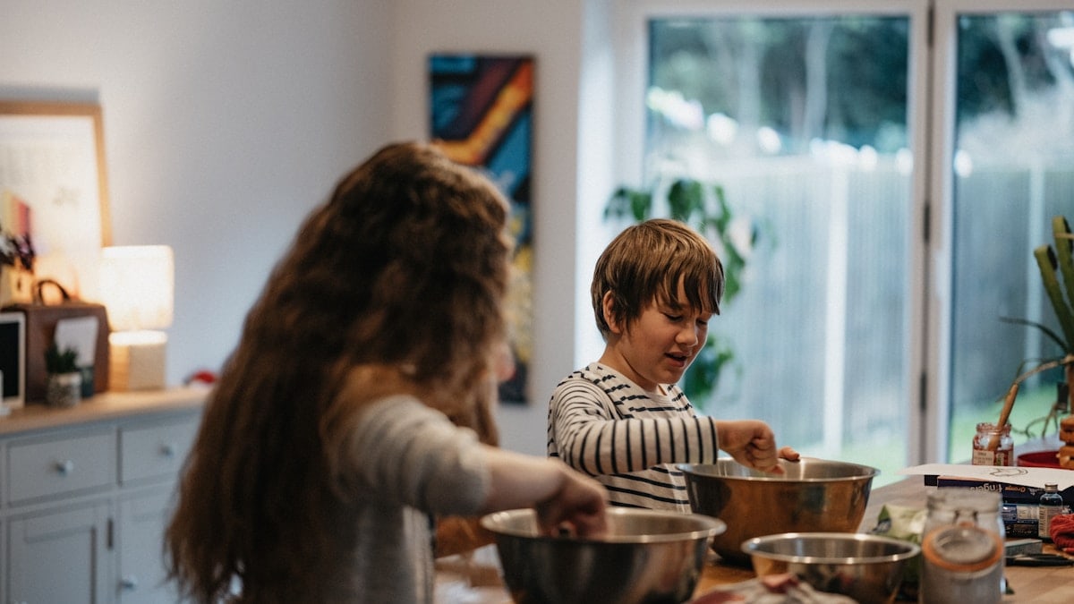 Kitty and Oz baking a Norman Castle cake for Ozzy's History homework.